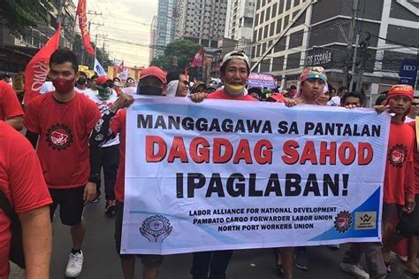 NegOr workers get wage hike .